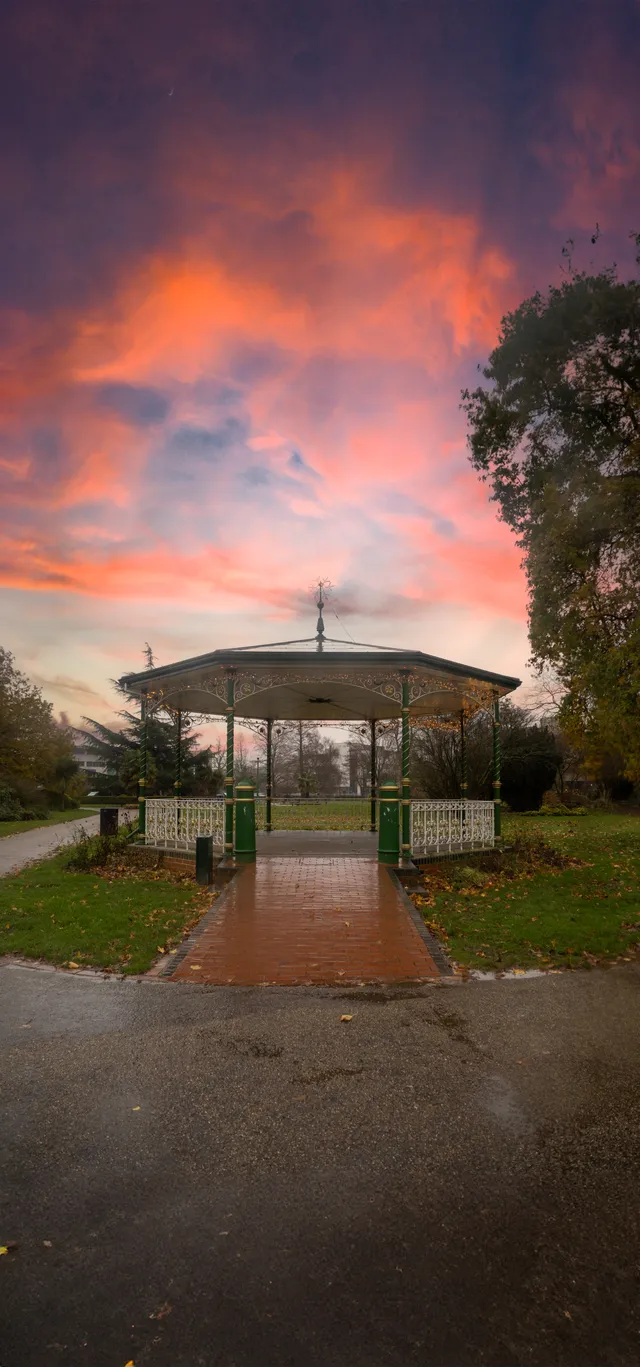A bandstand beneath a colourful evening sky