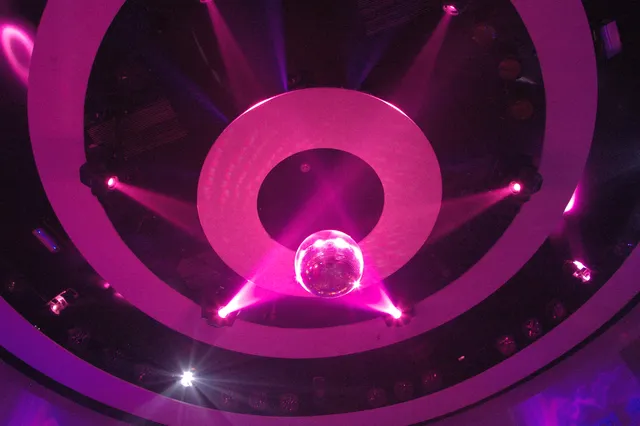 A vivid pink circular light pattern