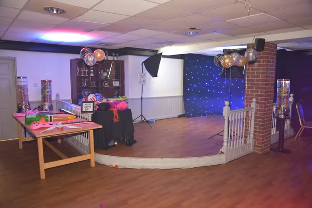 Tables and event details arranged inside a hall